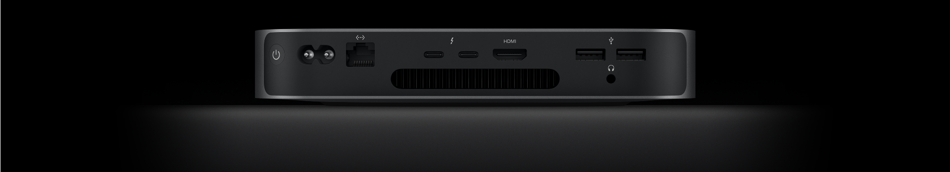 Back view of Mac mini showing the two Thunderbolt 4 ports, HDMI port, two USB-A ports, headphone jack, Gigabit Ethernet port, power port and power button.