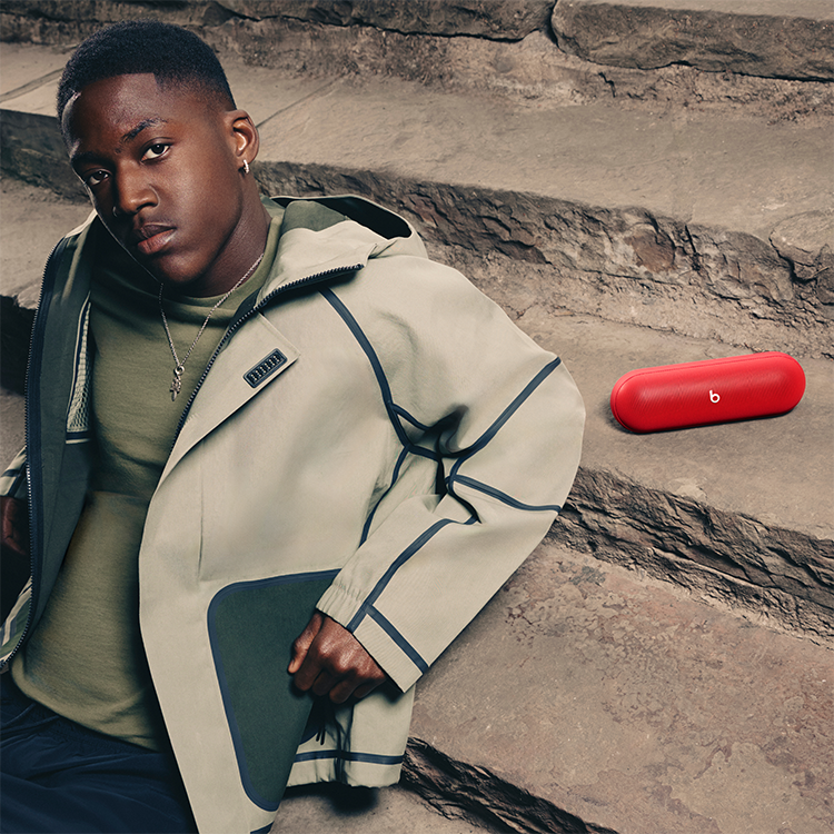 Beats pill lifestyle image with key product features