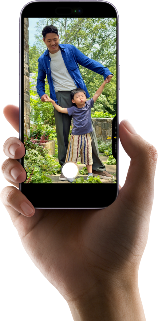 Hand holding iPhone using camera control button